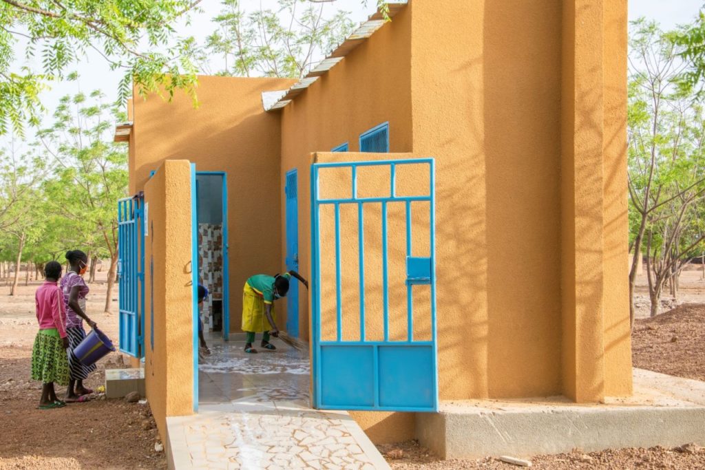 Girls clean their bathroom at school in Burkina Faso