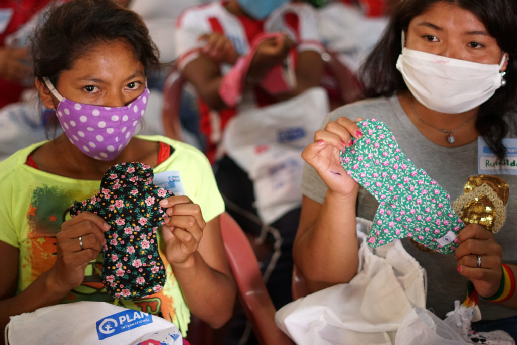 Women sew menstrual pads