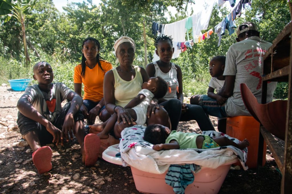 Salinda, 22 and her family at home in south-east Haiti