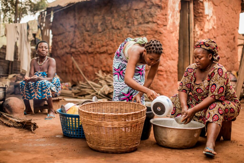 Women wash dishes