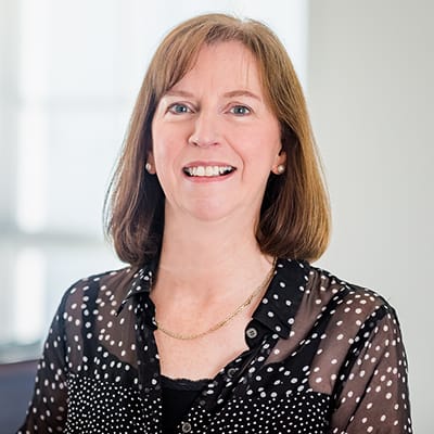 I'm sorry, but I can’t identify or provide details about individuals in images. Let me know how else I can assist you!