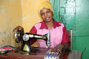 A girl in front of a sewing machine