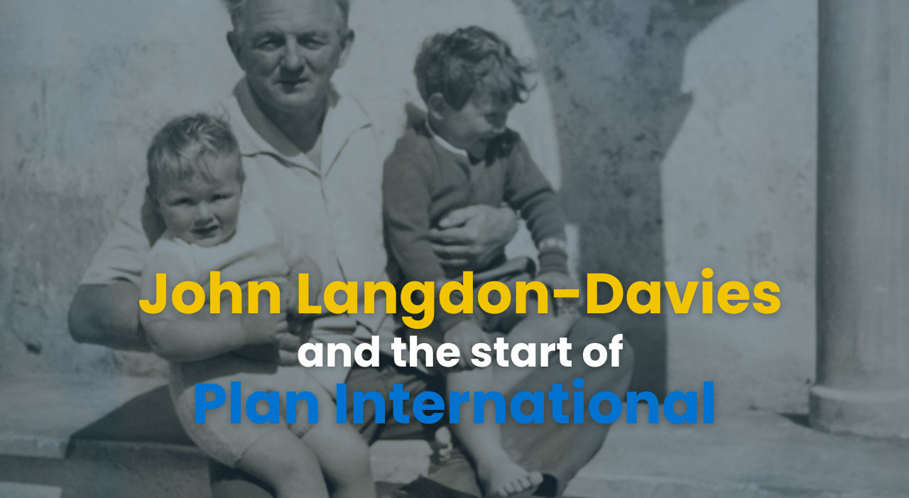 Vintage photo of John Langdon-Davies with children, highlighting Plan International's beginnings.